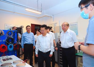 周堅會見上海電力大學黨委書記李明福一行